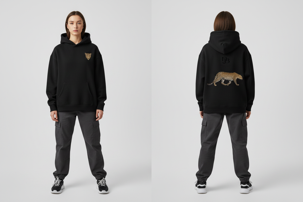 Female model wearing the Cheetah DJB Oversize Fleeced Hoodie, showing the front and back print