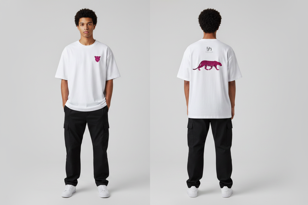 Male model wearing the DJB Cheetah Unisex Oversized Drop Shoulder T-Shirt, showing the front and back print