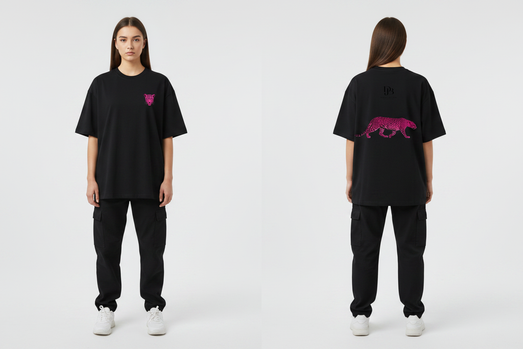 Female model wearing the DJB Cheetah Unisex Oversized Drop Shoulder T-Shirt, showing the front and back print