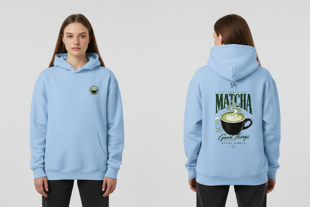 Woman wearing the Sky Blue MATCHA heavyweight pullover hoodie, showing the front and back artwork.
