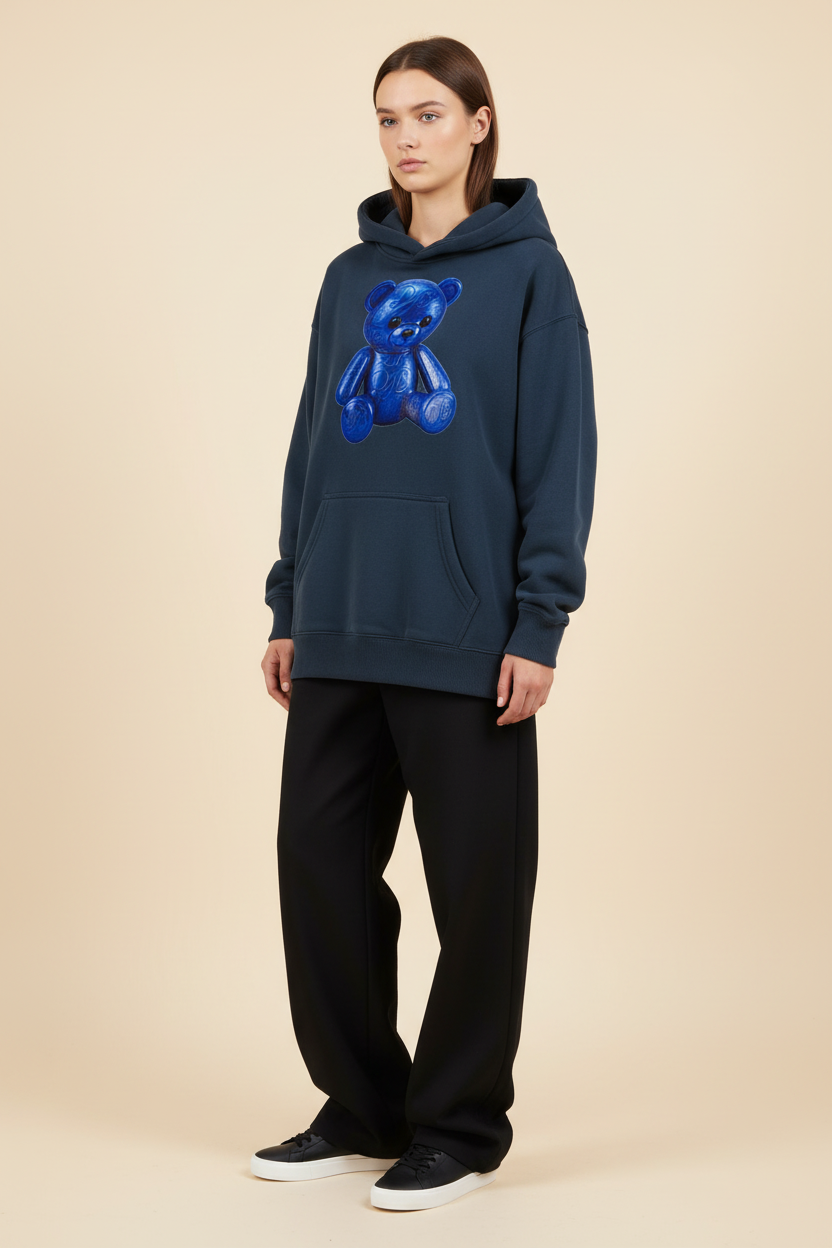Female model wearing the navy Teddy Oversize Fleeced Hoodie with coordinated black trousers and minimalist sneakers