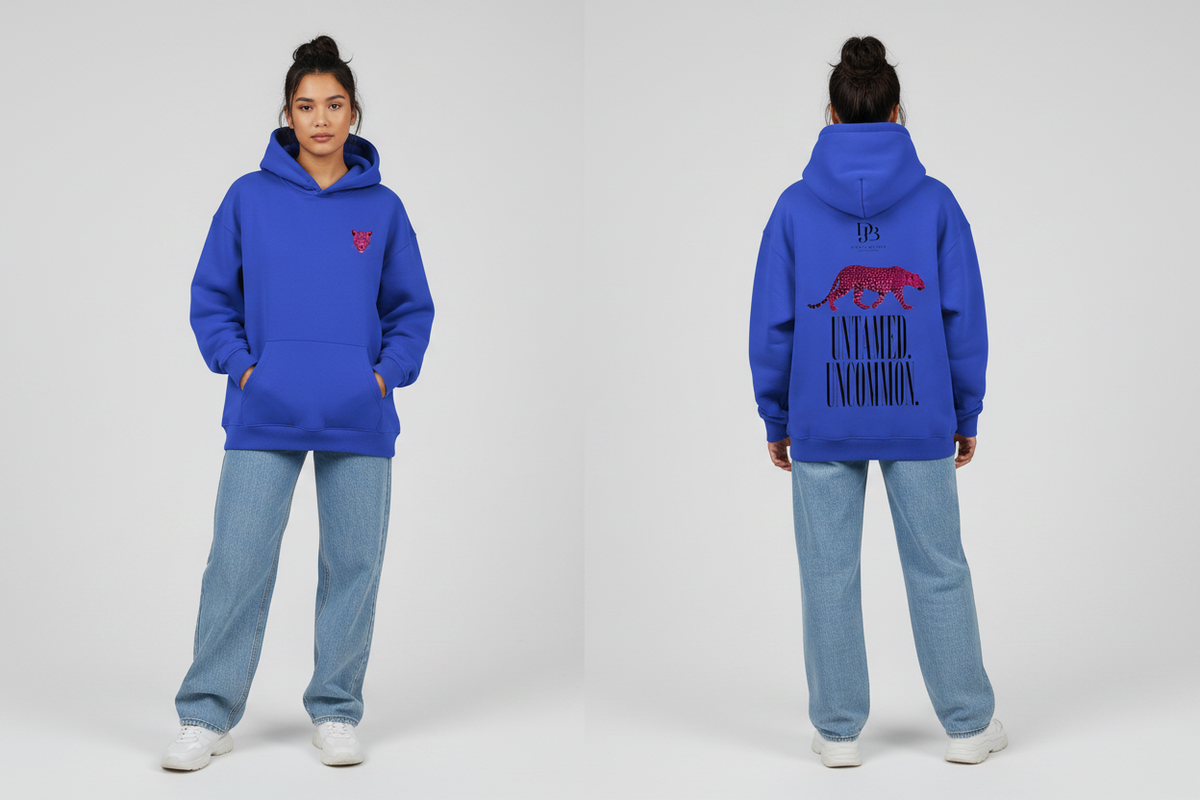 Female model wearing the Cheetah Purple DJB Oversize Fleeced Hoodie, showing the front and back print