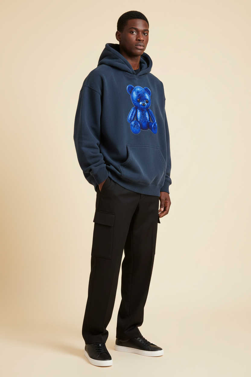 Male model wearing the navy Teddy Oversize Fleeced Hoodie with coordinated black trousers and minimalist sneakers
