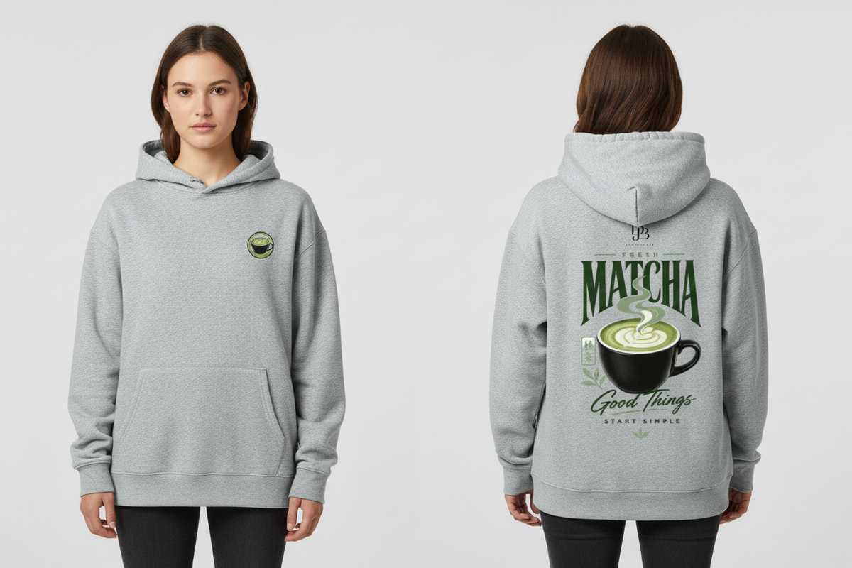 Woman wearing the Oat Gray MATCHA heavyweight pullover hoodie, showing the front and back artwork.